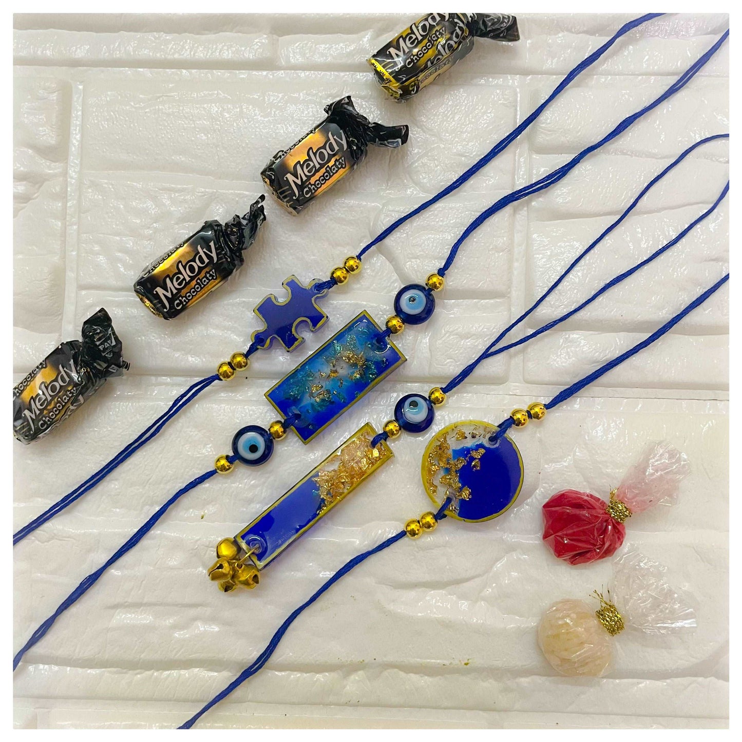 Blue Resin Evil Eye Rakhi Set of 4 - beattrangi