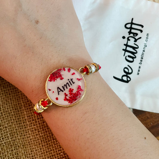 Red Name Rakhi with Real Lace Flower