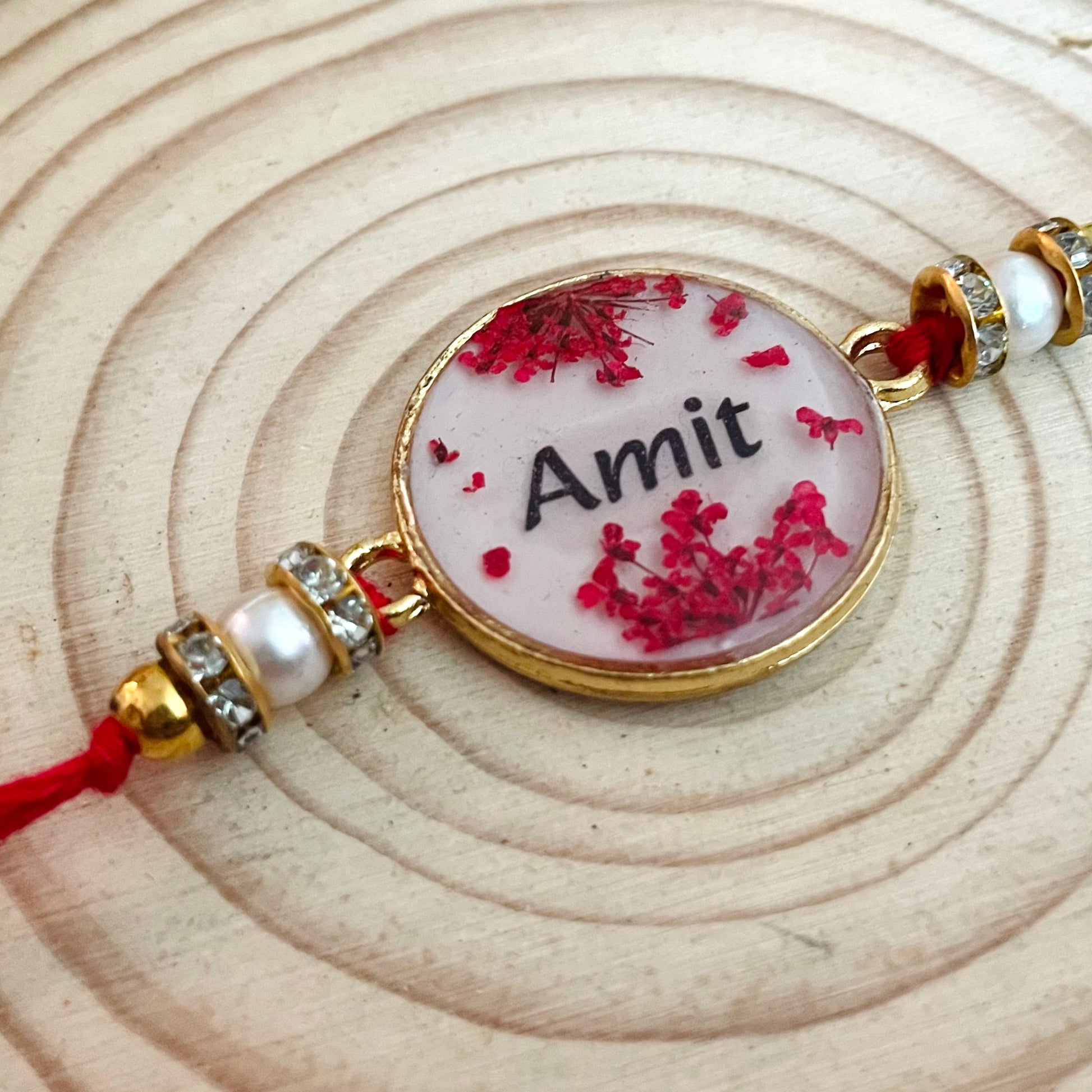 Red Name Rakhi with Real Lace Flower