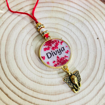 Red Name Rakhi with Real Lace Flower