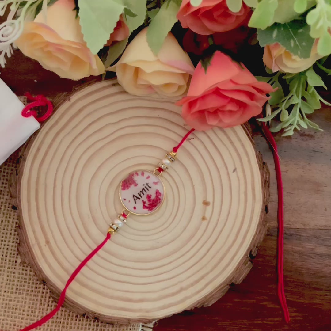 Red Name Rakhi with Real Lace Flower